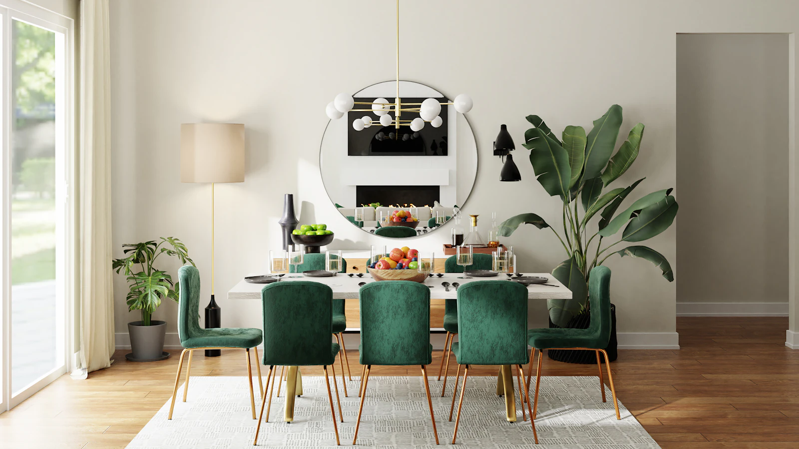 Dining area with emerald velvet chairs, round mirror and pendant light